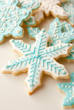 some cookies that are on a table with the words coming soon sugar cookie written in blue