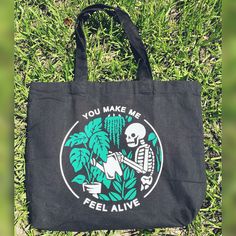 "This is the perfect little tote for a plant lover! This bag i light, and roomy- can hold a lot! Black bag measures 16.5\"W x 15\" H. Tote is washable, lay flat to dry. Canvas material" Green Tote Bag With Eco-friendly Ink, Botanical Canvas Bags For Everyday Use, Botanical Style Canvas Bags For Everyday Use, Eco-friendly Everyday Bag With Plant Print, Everyday Tote Bag With Plant Print, Botanical Bags With Plant Print For Everyday Use, Everyday Botanical Style Bag With Plant Print, Everyday Botanical Bags With Plant Print, Botanical Style Everyday Tote Bag