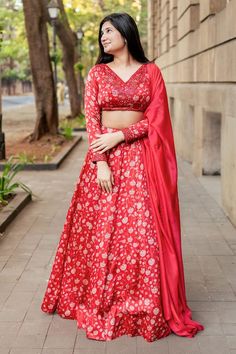 Red attached cancan lehenga with all over floral print. Paired with a printed padded blouse with placed hand embroidery and dupatta with matching hand embroidery. - Aza Fashions Festive V-neck Lehenga With Dupatta, Festive V-neck Lehenga With Zari Work, Festive V-neck Lehenga With Resham Embroidery, Festive V-neck Lehenga, Festive Semi-stitched Lehenga With V-neck, Designer Bollywood Lehenga With V-neck, Festive Semi-stitched V-neck Lehenga, Festive Resham Embroidery V-neck Lehenga, Bollywood Style Lehenga With V-neck Dupatta