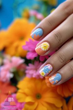 Embrace the summer vibes with these stunning cool summer nail designs! Featuring a mix of blue and orange hues with delicate floral details, these nails are perfect for any summer occasion. Get inspired by these cool summer nails and visit nailhow.com for more summer nail inspo.