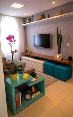 a living room filled with furniture and a flat screen tv