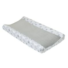 a white and gray baby crib mattress with elephant print on the bottom, in front of a white background