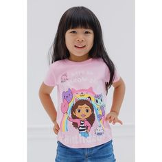 Celebrate your special day with Gabby and her friends in this stylish Gabby's Dollhouse birthday shirt! This cute short sleeve tee features a fun rainbow design, the words "Have An A-Meow-Zing Birthday," and colorful artwork of Gabby, MerCat, Kitty Fairy, and Cakey Cat holding birthday balloons. Dressed in this soft and comfy Gabby's Dollhouse tshirt, your little girl is ready for an exciting birthday adventure! Pink Short Sleeve T-shirt For Playtime, Cute Short Sleeve T-shirt For Playtime, Pink Fun T-shirt For Playtime, Multicolor Short Sleeve T-shirt With Hello Kitty Print, Cute Rainbow Short Sleeve Tops, Rainbow Short Sleeve Top For Birthday, Rainbow Short Sleeve Top For Birthdays, Gabby's Dollhouse Birthday, Birthday Toddler Girl