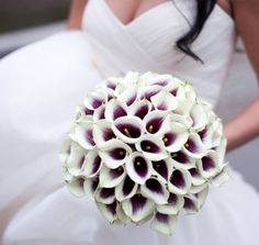 a bride holding a bridal bouquet in her hand