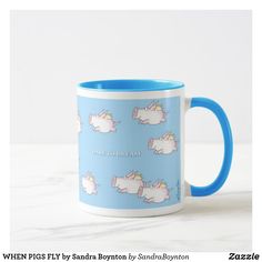 a blue and white coffee mug with unicorns on it