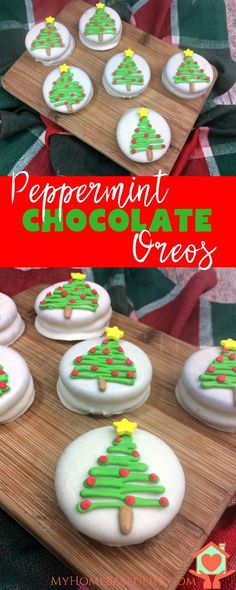 cookies decorated with green and red icing are on a wooden tray next to a plaid tablecloth