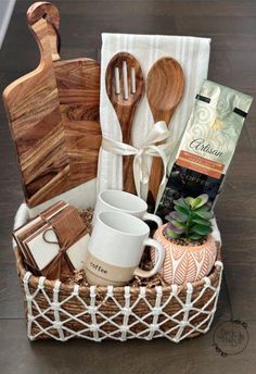 a basket filled with wooden utensils and other kitchen items on top of a table