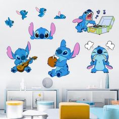 the cartoon stitchers are playing guitar and singing on their own wall decals in this living room