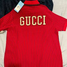 New! 100 Percent Authentic. Never Worn ! With Tags Classic Gucci Polo Collar Top, Casual Gucci Collared Top, Designer Red Long Sleeve Tops, Designer Long Sleeve Red Top, Gucci Luxury Collared Shirt, Luxury Gucci Collared Shirt, Red Gucci Cotton Top, Designer Gucci Collared Shirt, Casual Red Gucci Tops