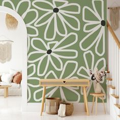 a living room with green and white wallpaper