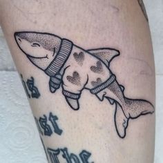 a shark tattoo with hearts on it's legs and the words i love you