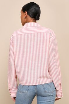 Cute and casual vibes come together to create the trendy look that is the Lulus Chic Marvel Pink and Ivory Striped Button-Up Long Sleeve Top! Breezy, cotton-blend woven fabric, with a white and pink striped pattern throughout, shapes a classy collared neckline and long sleeves with drop shoulders and button cuffs. An oversized, cropped bodice features a front patch pocket and functional button placket at the center. Fit: This garment fits true to size. Length: Size medium measures 22.50" from sh Chic Cotton Shirt With Roll-up Sleeves, Chic Spring Tops With Buttoned Pockets, Chic Blouse With Buttoned Pockets For Day Out, Chic Spring Tops With Roll-up Sleeves, Trendy Shirt With Buttoned Pockets, Casual Spring Shirt With Button Cuffs, Trendy Cotton Shirt With Button Cuffs, Spring Vacation Shirt With Button Cuffs, Spring Relaxed Fit Blouse With Buttoned Pockets