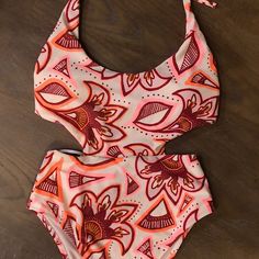 New Without Tags! Super Cute Aerie Swimsuit With Maroon, Neon Pink And Orange Floral Designs! Size S The First Three Photos Are The Best Representation Of The Color Of The Suit. Material: 80% Nylon, 20% Elastane Casual Cutout Swimwear For Beach, Casual Pink One-piece Swimwear, Pink Cutout Swimwear For Pool, Pink Cutout Swimwear For Beach, Pink Cutout Swimwear For The Pool, Fitted Orange One-piece Swimsuit, Fitted Orange One-piece Swimsuit For Beach, Pink Beach Swimwear With Cutout, Orange One-piece Swimwear For Beach