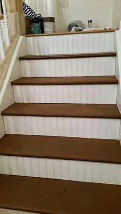 some brown and white stairs in a house