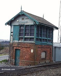 an old train station sitting on the tracks