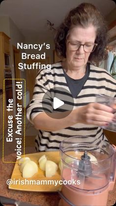 a woman is making some food in a blender