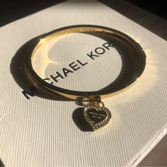 Featuring A Logo Heart Id Tag With A Pave Crystal Halo, This Gold-Tone Hinged Bracelet By Michael Kors Is Simple But Striking. Brand New Without Tags, Excellent Condition. Woman Hygiene, Adidas Gucci, Michael Kors Bracelet, Logo Heart, Vintage Thrift, Winter Festival, Michael Kors Jewelry, Jewelry Accessories Ideas, Stainless Steel Bangles