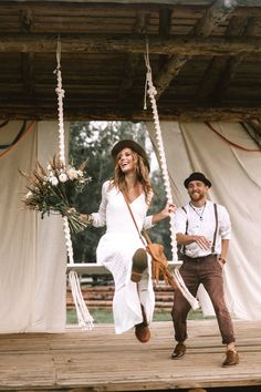 a man and woman are walking on a porch swing