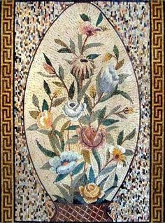 a mosaic with flowers and leaves on it