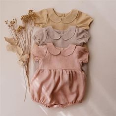 This Petal Collar Baby Romper will make your little girl look like a princess. It has a beautiful petal-shaped collar and elastic sleeves for the best fit. Its color is very refreshing and simple, perfect for spring and summer! Material: Cotton Linen Cute Solid Bubble Romper For Spring, Cute Solid Color Bubble Romper For Spring, Summer Bubble Romper With Ruffles And Puff Sleeves, Summer Puff Sleeve Bubble Romper With Ruffles, Fitted Solid Color Bubble Romper For Playwear, Fitted Puff Sleeve Bubble Romper For Spring, Spring Bubble Romper With Short Sleeves For Playwear, Fitted Solid Bubble Romper For Summer, Solid Color Short Sleeve Bubble Romper For Spring