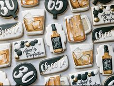 decorated cookies are arranged on a table with black and white lettering that read 30 years