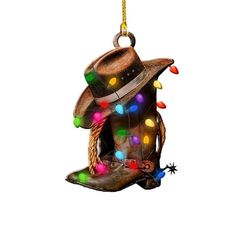 a christmas ornament with a cowboy hat and boots hanging from it's side