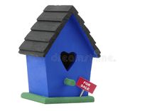 a blue birdhouse with a for sale sign in front of it royalty images and stock photos