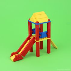 a toy slide set made out of lego blocks