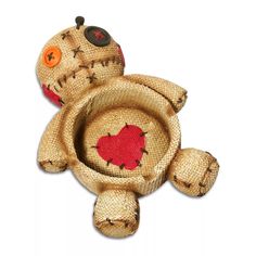 a brown teddy bear with red heart on it's back