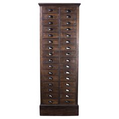 a tall wooden cabinet with many drawers on it's sides and one door open