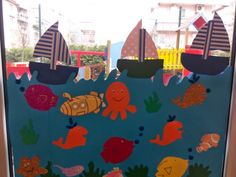 a door decorated with sea animals and boats