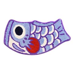 an embroidered patch with a fish on it