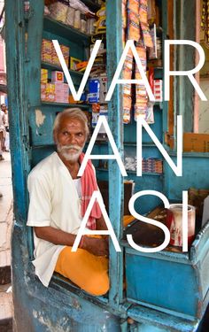 a man sitting in the doorway of a store