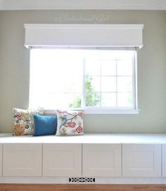 window seat from ikea cabinets with decorative pillows