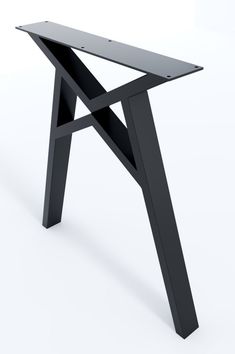 a black table sitting on top of a white floor