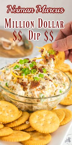 a hand dipping a cracker into a glass bowl filled with million dollar dips