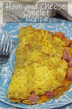 ham and cheese omelet recipe on a blue plate with a knife and fork