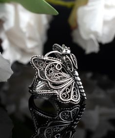 Indulge in the exquisite beauty of this Handcrafted Filigree Art 925 Sterling Silver Women Cocktail Statement Ring. Crafted with precision, this ring boasts an intricate filigree design that is sure to catch everyone's eye. Perfect for special occasions or everyday wear, this statement ring is a must-have for any fashion-forward woman. Made from high-quality 925 sterling silver, this ring is both durable and stylish. The unique design of this ring makes it a perfect gift option for your loved on Butterfly Cocktail, Crown Butterfly, Art Crown, Metal Embroidery, Jewelry Trending, Silver Cocktail, Silver Polish, Sterling Silver Filigree, Filigree Design