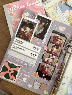 an open planner book with stickers on it