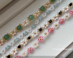 the beaded bracelets are all different colors and sizes, but one is gold