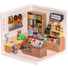 a toy store with books and toys on display in the front room, including an open bookcase