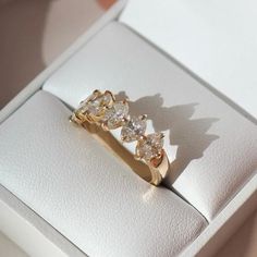 three diamond rings sitting in a white box