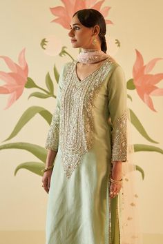 Green straight kurta with floral zardozi embroidery, highlighted with dabka, nakshi, sequins and crystals work. Paired with a pant with zardozi embroidery and dupatta. - Aza Fashions Cotton Silk Sharara With Zari Work For Reception, Unstitched Straight Kurta Suit For Diwali Reception, Diwali Reception Unstitched Straight Kurta Suit, Slub Silk Kurta With Zari Work For Reception, Pista Green Chikankari Embroidery Set For Reception, Semi-stitched Cotton Silk Sharara For Reception, Unstitched Dola Silk Suit For Reception With Straight Kurta, Cotton Silk Semi-stitched Sharara For Reception, Dola Silk Unstitched Suit For Reception