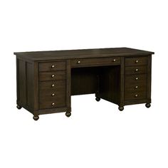 an office desk with drawers and wheels on the bottom drawer, in dark brown wood