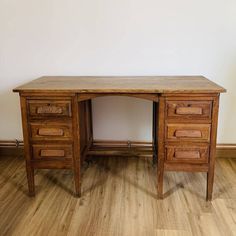 an old wooden desk with two drawers on the bottom and one drawer at the top