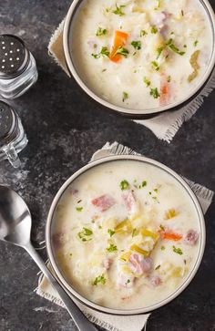 two bowls filled with soup on top of a table