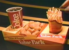 an assortment of food including french fries, cheetos and soda