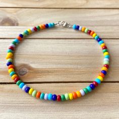 The Multicolored Anklet is a sporadic combination of every color in the rainbow. This mismatch piece can go with just about any outfit you can think of! All anklets are customizable to the size you need so please be sure to measure your ankle where you want your anklet to sit and order accordingly! This high quality beaded anklet is secured with a sterling silver lobster claw and made with glass beads that can stand the test of time, making it perfect for everyday use. Keep in mind you are looki Bead Anklets, Seed Bead Anklet, Bracelets With Beads, Bead Anklet, Making Bracelets With Beads, Embroidery Painting, Diy Collier, Beaded Anklet, Bracelets Handmade Diy