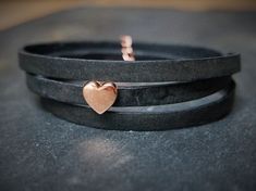 A black leather wrap bracelet with a beautiful rose-golden heart charm. It comes gift wrapped in a handmade Origami envelope and a colour matching organza pouch. A little handwritten note can be added for that extra personal touch.   It is 5mm wide and 51 - 54cm long (adjustable with a chain extender) The bracelet wraps around the wrist 3 times. The bracelet is made from real leather, can vary in texture and colour and has a nice "vintage effect". Also available in brown or tan leather. Bracelet Heart, Black Leather Bracelet, Chain Extenders, Moon Jewelry, Leather Wrap Bracelet, Swarovski Pearls, Boho Bracelets, Heart Bracelet, Leather Wraps