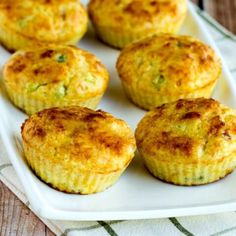 several small muffins on a white plate